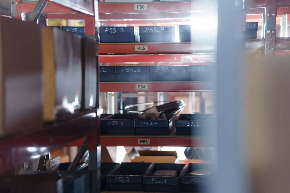 A well-organized warehouse shelving unit with numbered bins for efficient storage and inventory management.