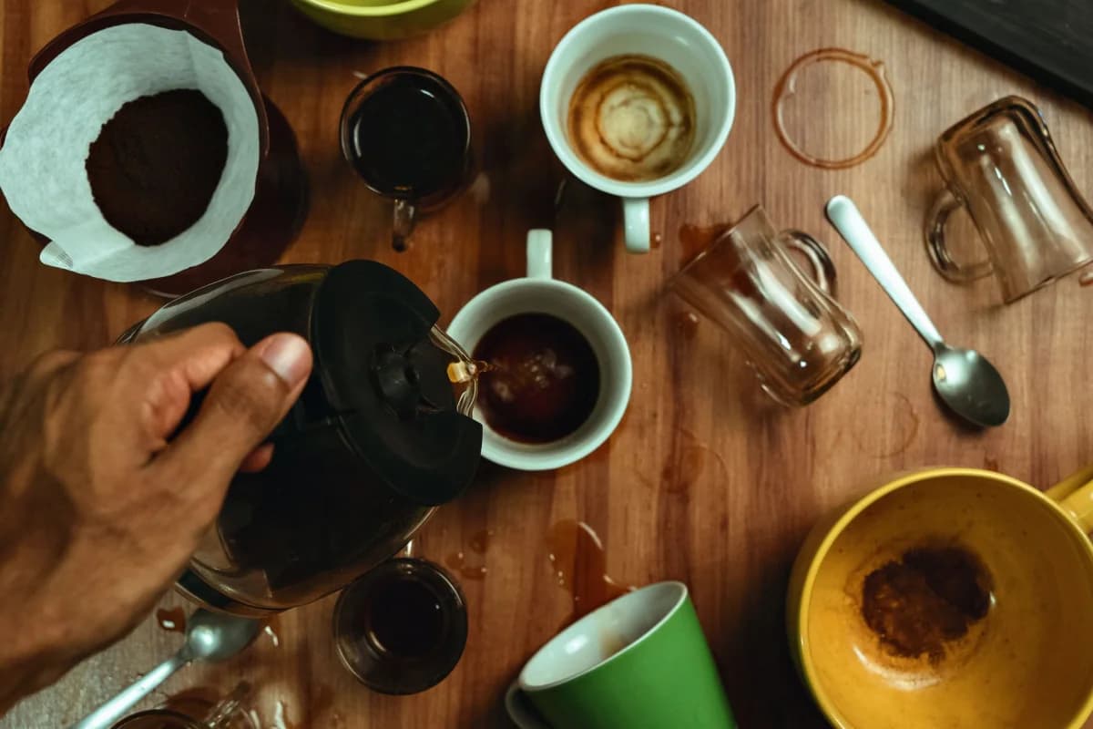 Coffee being poured into cups from above