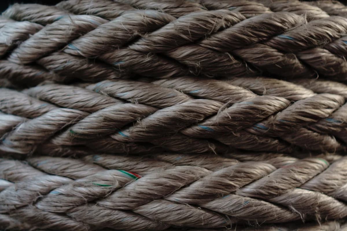 Macro shot showcasing the intricate texture and fibers of braided brown rope.