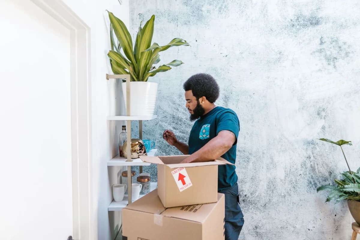 Person examining items on a store shelf