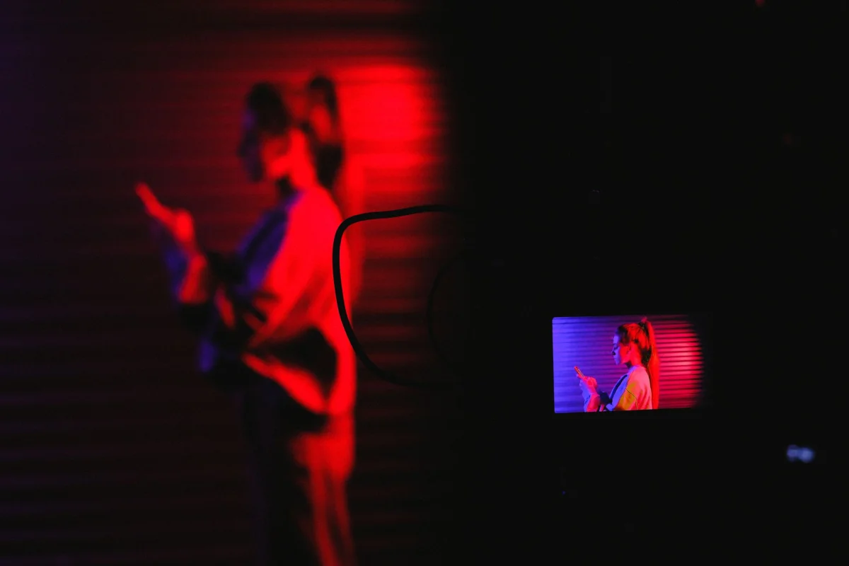 Person browsing a phone in a dark room