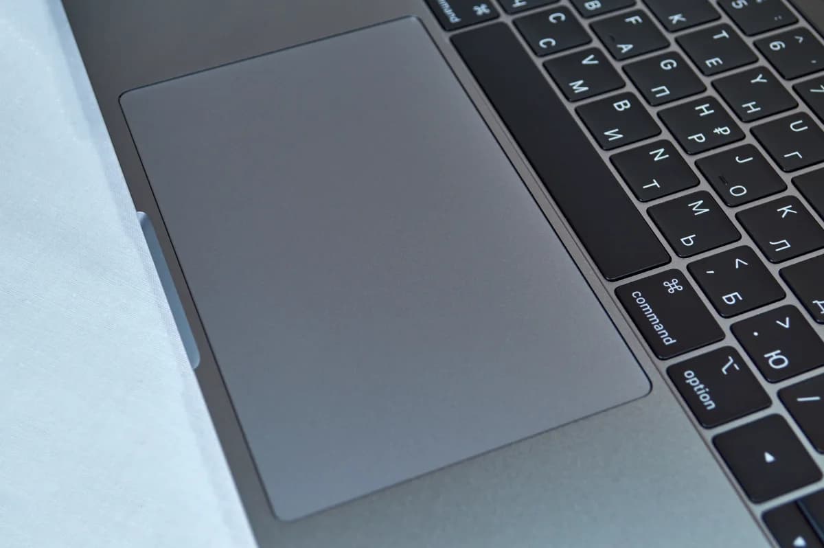 Laptop open on a desk, close view of keyboard