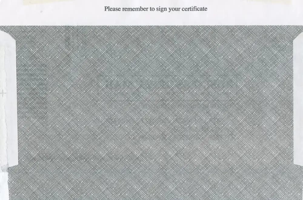 Close-up view of security paper with text reminding to sign certificate.