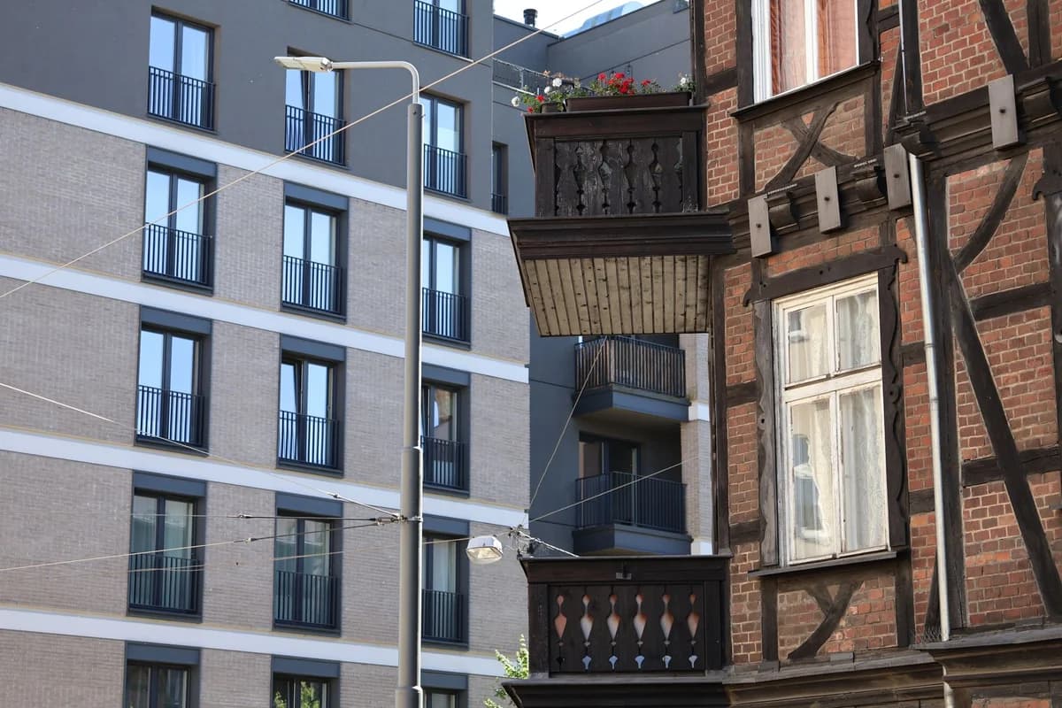A juxtaposition of modern and historic buildings in a cityscape, highlighting urban contrasts.