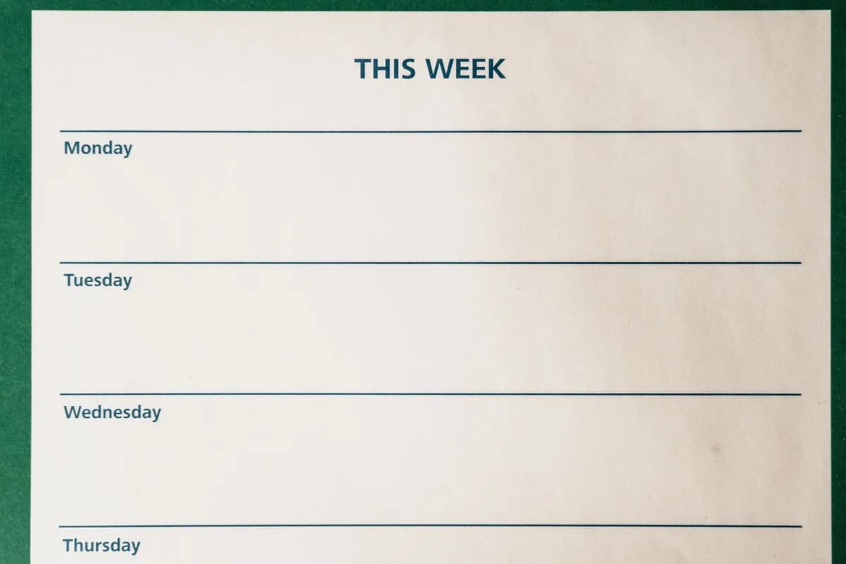 Minimalist blank weekly planner with days for scheduling and organizing tasks.